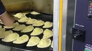 دستگاه گردان حرارت غیر مستقیم | پخت پیراشکی با فر گردان صنایع پخت مشهد